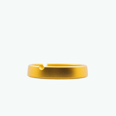 Metallic ashtray from The Coffeeshops, featuring a sleek design with a shiny metallic finish and circular shape.