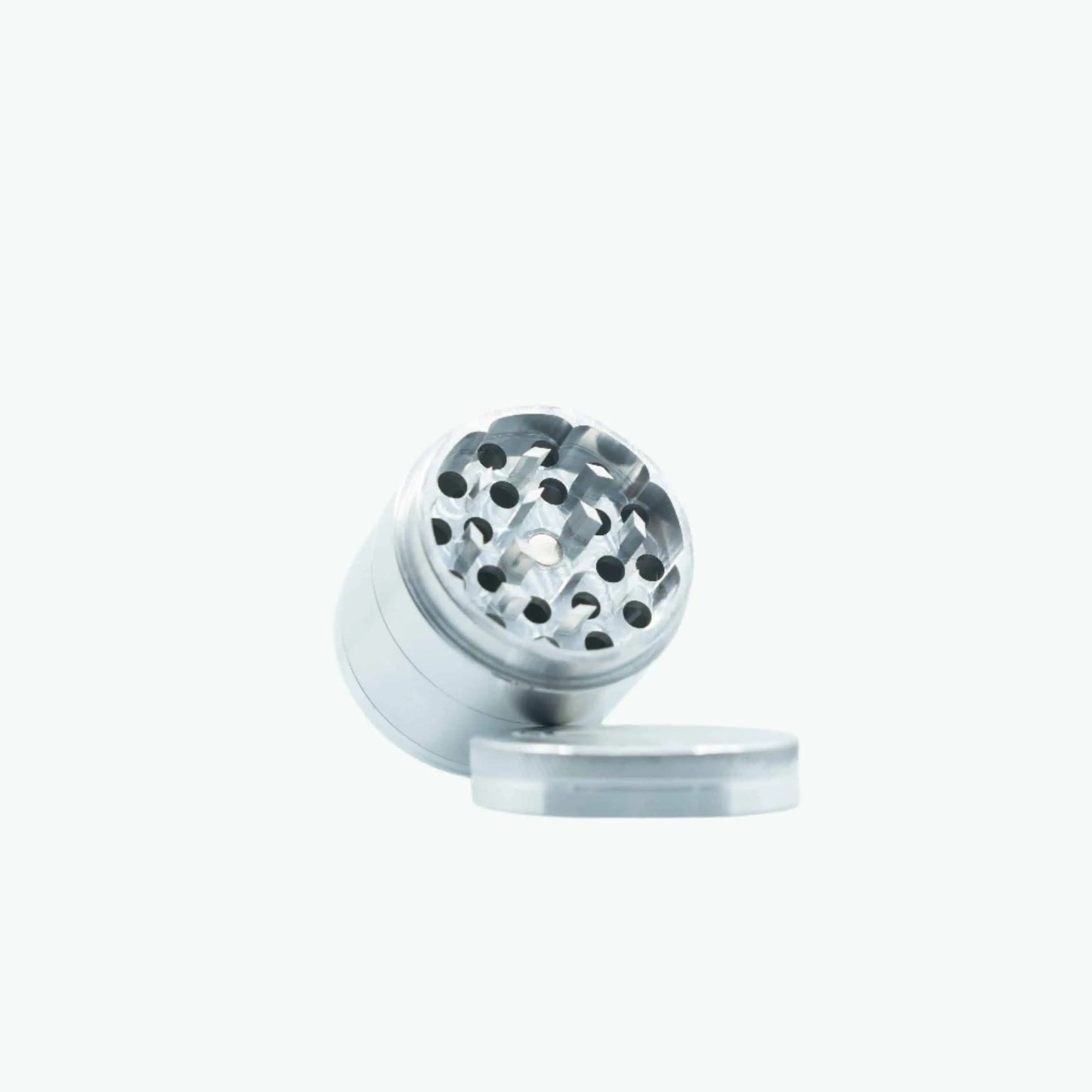 Large silver metal grinder by The Coffeeshops with textured surface and multiple grinding layers.