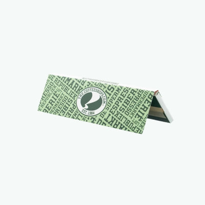 King size slim rolling papers by Purize, featuring natural paper with branding and packaging visible.